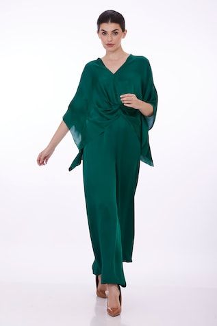 Emerald green draped kaftan with plunge V neckline. - Aza Fashions Chic Silk V-neck Kaftan, Elegant Draped Kaftan With Draped Sleeves, Elegant Green Kaftan For Evening, Elegant Green Kaftan For Party, Silk V-neck Evening Kaftan, Spring Evening V-neck Kaftan, Elegant Green Spring Kaftan, Draped Kaftan, Kaftan Sleeves