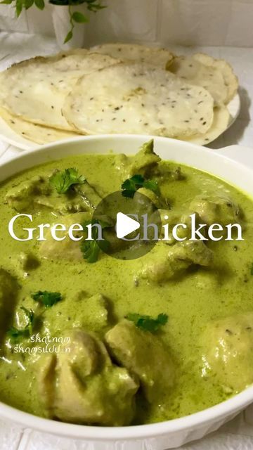 green chicken curry in a bowl with pita bread