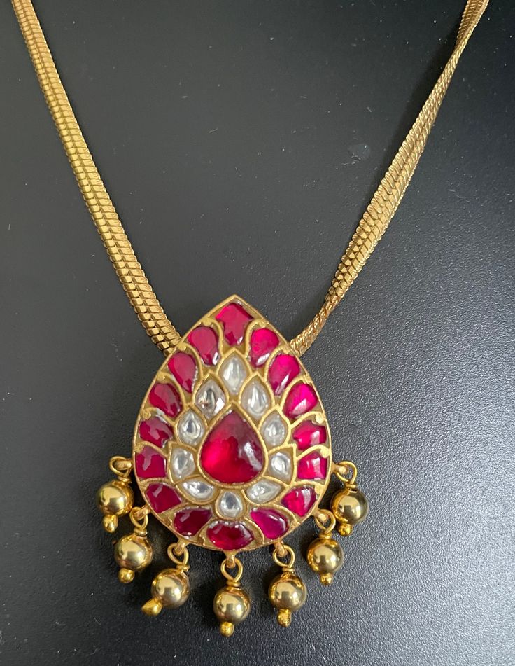 Jadau Kundan pendant with gold-finished chain. Brass based pendants and hand made. Gold Kundan Long Necklace, Traditional Necklace With Large Teardrop Pendant, Gold Long Kundan Necklace For Festive Occasions, Gold Metal Temple Jewelry Necklace, Festive Gold Long Kundan Necklace, Gold Temple Jewelry Style Necklace, Gold Kundan Necklace Gift, Festive Gold Plated Kundan Pendant Necklace, Handmade Yellow Gold Kundan Necklace For Gift