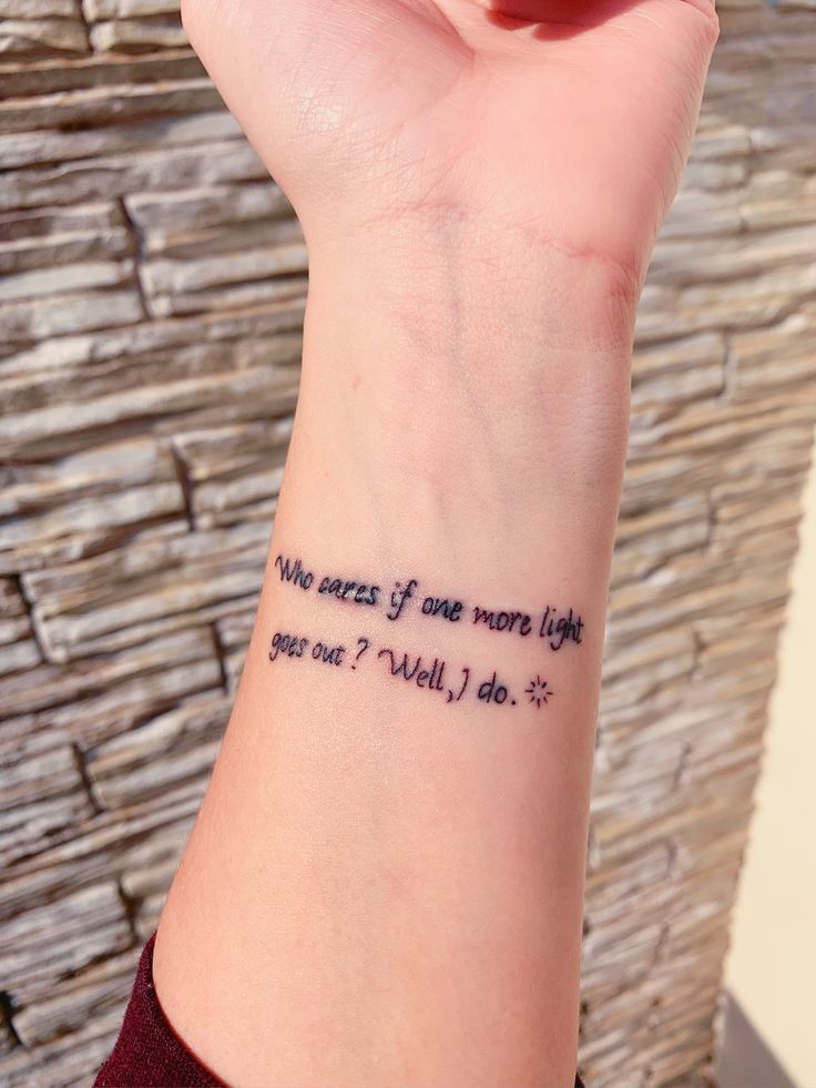 a woman's wrist tattoo with the words, we are all one more life