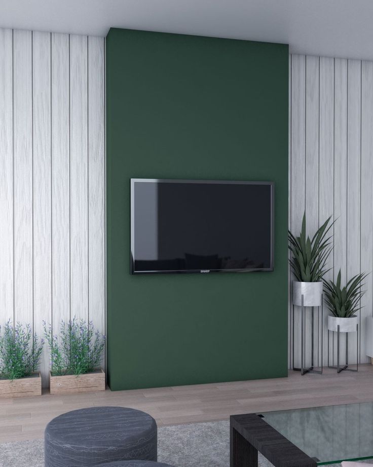 a living room filled with furniture and a flat screen tv mounted to the side of a wall