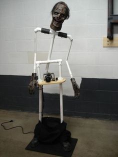 a white toilet sitting on top of a wooden chair with arms and legs attached to it