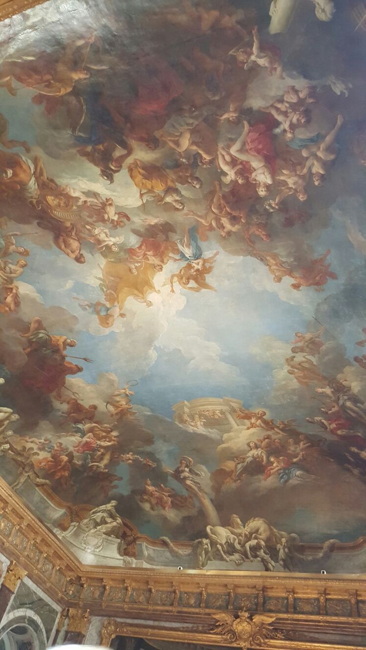 an ornate ceiling with paintings on it