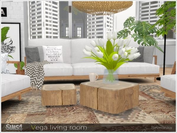 a living room filled with white furniture and lots of plants on top of it's tables