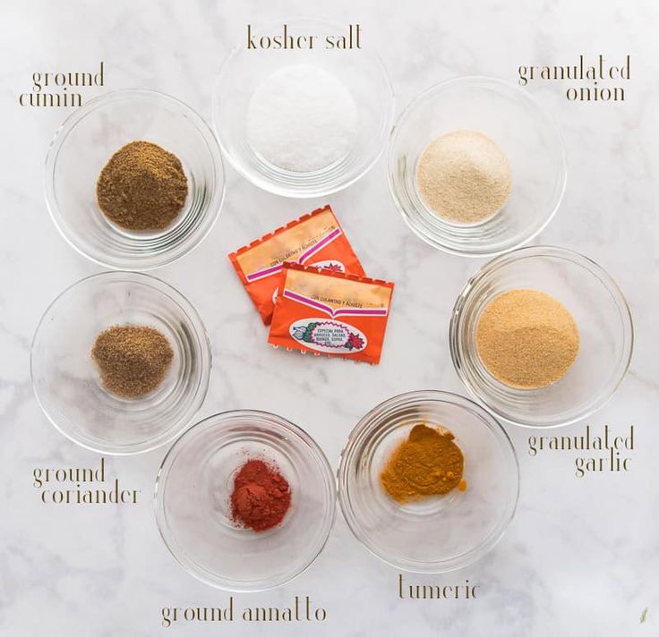 the ingredients needed to make this recipe are displayed in bowls on a marble countertop