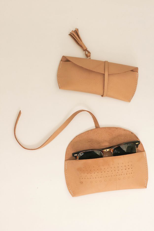 a tan leather case with sunglasses in it