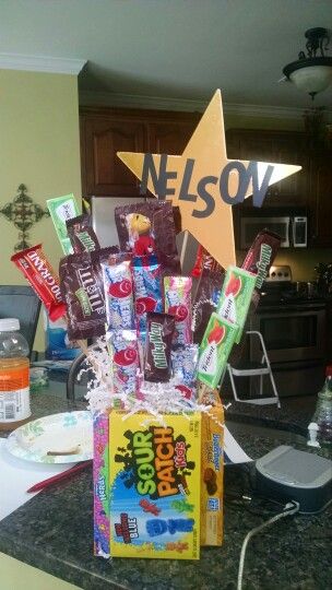 a box filled with candy sitting on top of a kitchen counter next to a star