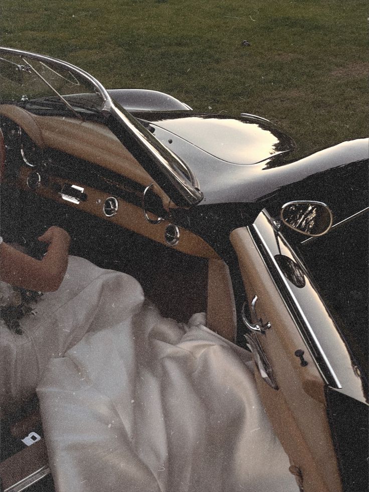 the interior of an old car is covered with white cloth