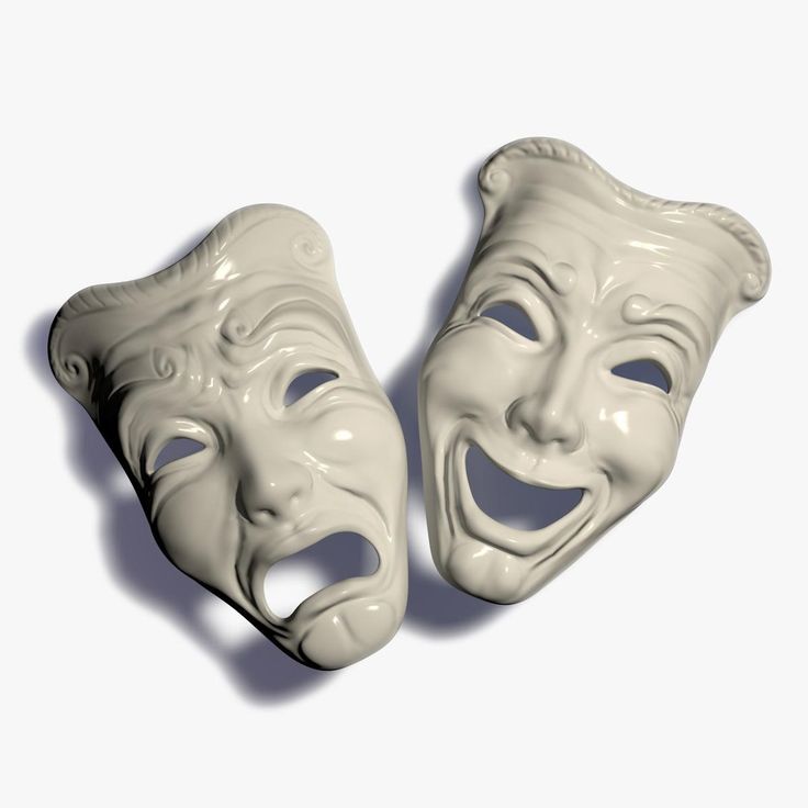 two white masks with faces painted on them