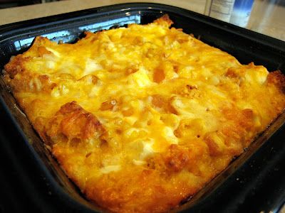 a square casserole dish with cheese and meat toppings on it, ready to be eaten