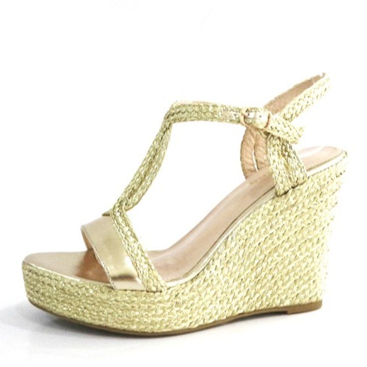 Gold Metallic Wedge With Braided Straps And Buckle At Ankle Gold Wedge Heel Sandals For Summer, Gold Wedge Sandals For Summer, Elegant Gold Wedge Sandals For Spring, Elegant Straw Platform Wedge Sandals, Elegant Synthetic Wedge Sandals For Vacation, Elegant Gold Wedge Sandals For Vacation, Gold Platform Wedge Sandals For Spring, Chic Gold Wedge Sandals For Vacation, Elegant Gold Wedge Sandals For Beach