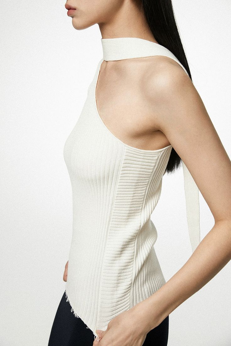 Experience effortless sophistication with our Asymmetrical Neck Sleeveless Ribbed Top, a statement piece that redefines contemporary cool.
This exquisite ribbed top is crafted from a blend of high-quality viscose and polyester, ensuring a soft and comfortable fit with enough stretch for a flattering silhouette. Its defining feature, the asymmetrical neck cut, offers an intriguing twist to the classic sleeveless design, perfect for those seeking a touch of the unconventional.
Channel your inner s Elegant Ribbed Tank Top, Elegant Ribbed Tank Top For Summer, Elegant Ribbed Summer Tank Top, Asymmetrical Ribbed Stretch Top, Chic Asymmetrical Ribbed Top, Chic Tank Top With Ribbed Neckline, Elegant Ribbed Summer Tops, Modern Ribbed Spring Top, Modern Ribbed Tops For Spring