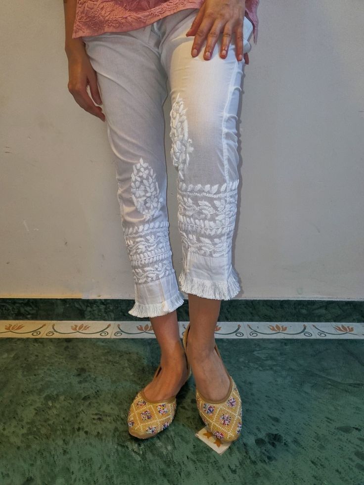 Soft Pure cotton Slim Pants with tassel trims and embroidered in chikankari. Side Pockets. Length - S - 37 inches M - 37 inches L - 38 inches XL - 38 inches XXL - 39 inches Size - S - waist stretched fits upto 40 M - waist stretched fits upto 42 L - waist stretched fits upto 44 XL - waist stretched fits upto 46 XXL - waist stretched fits upto 48/50 Cotton Straight Pants, Tassel Lace, Slim Pants, Straight Pants, Trousers Women, Pure Cotton, Favorite Outfit, Capri Pants, Tassels