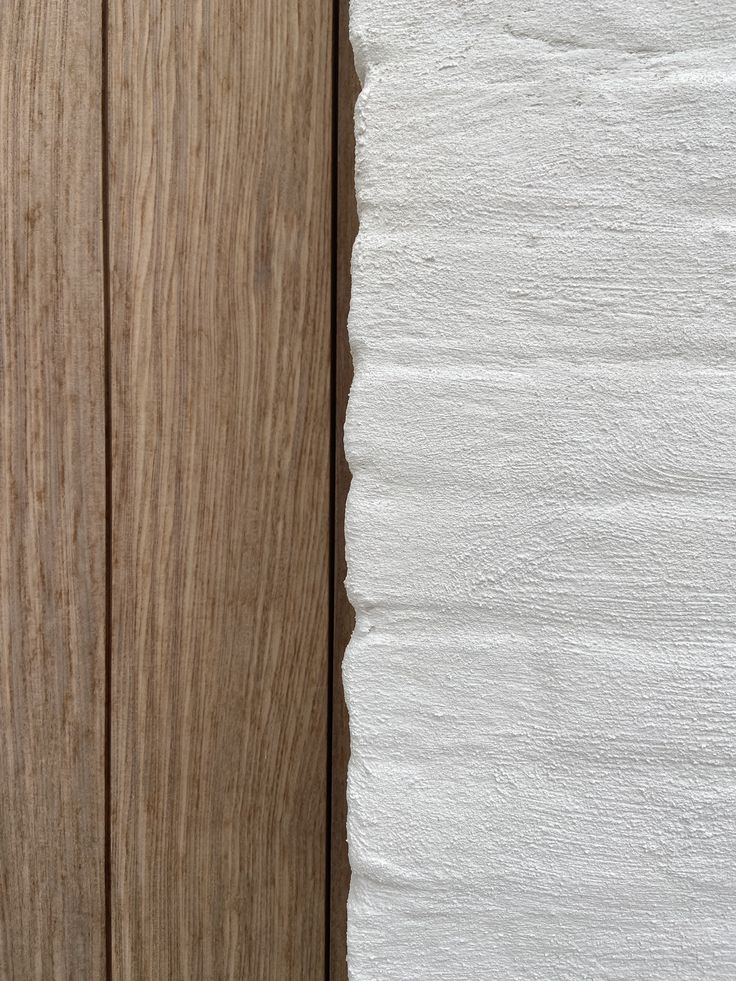 a white piece of paper sitting on top of a wooden door