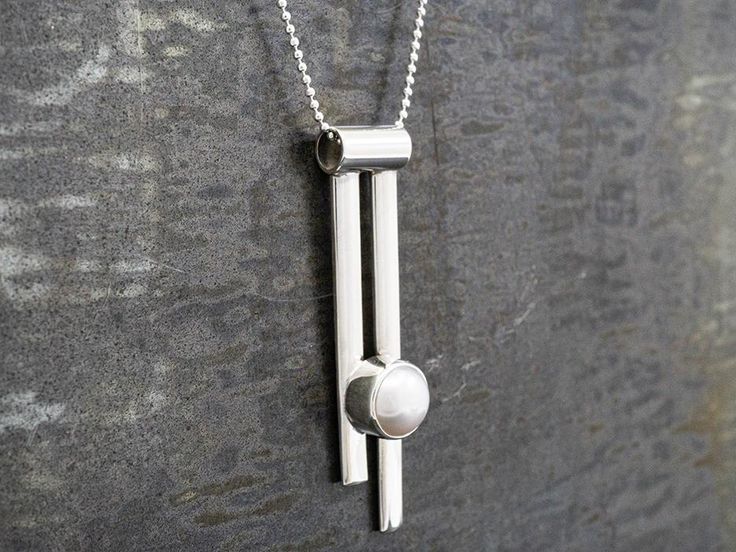 Rosario set a genuine pearl in an edgy vertical setting that fits right in with our Pendulum collection. Delivered on an 18' sterling silver chain. $49 4 grams. Silver Jewelry Handmade, Metal Work, Silver Pearls, Silver Jewellery, Sterling Silver Chain, Pearl Pendant, Sterling Silver Chains, Silver Fashion, Silver Chain