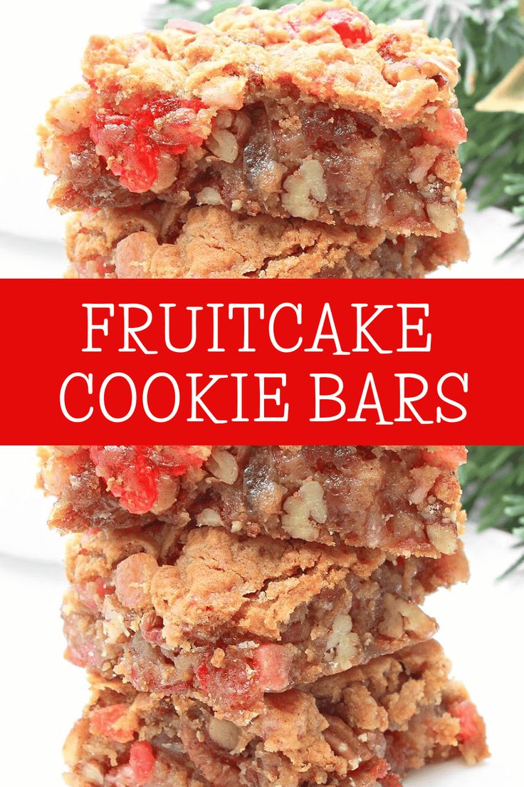 fruitcake cookie bars stacked on top of each other in front of a christmas tree