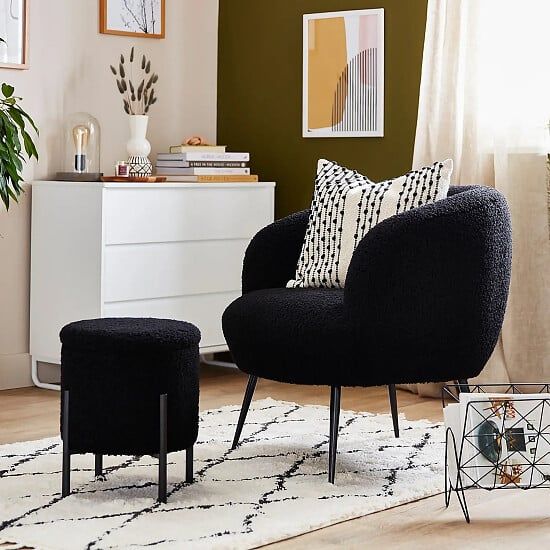 a chair and ottoman in a living room