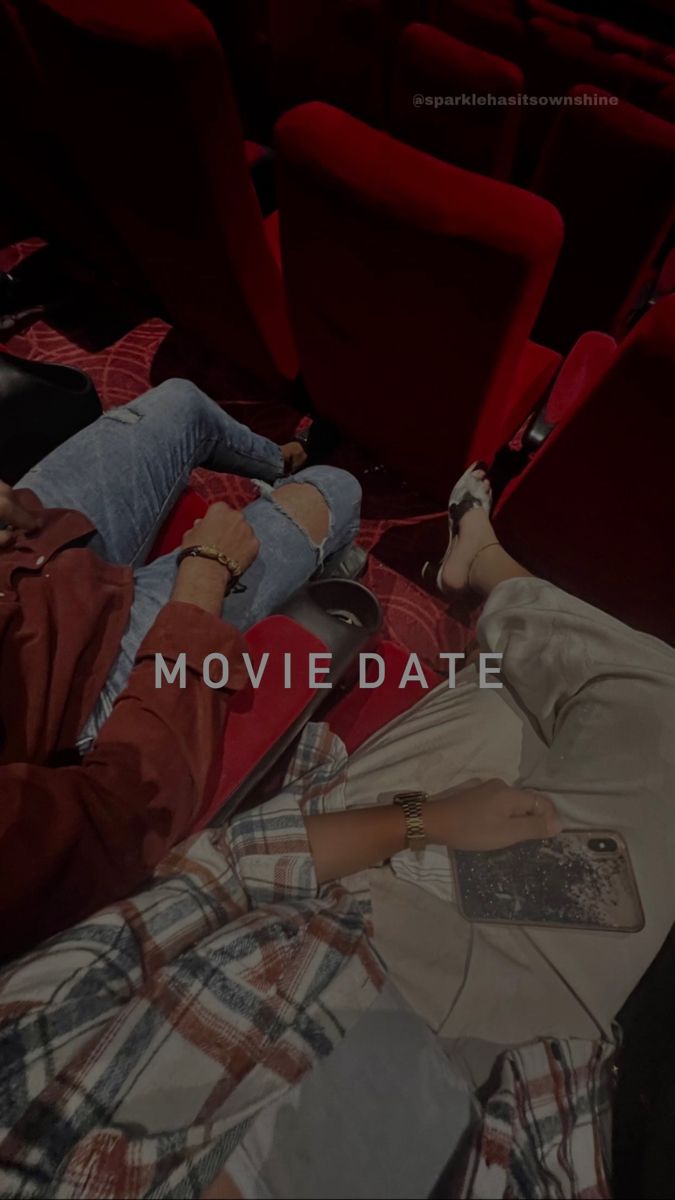 two people laying on the floor in front of red chairs with text reading movie date