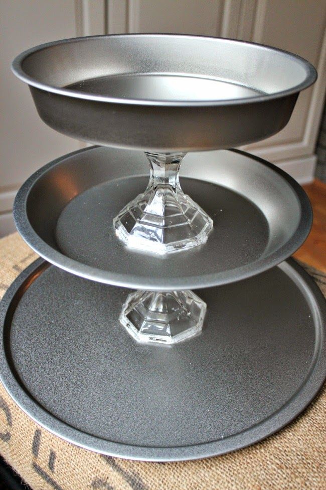 three tiered cake pans sitting on top of each other