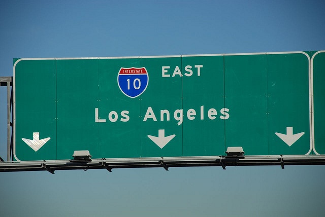 an interstate sign that says east los angeles with arrows pointing to the right and left