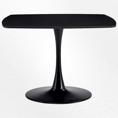 a black table sitting on top of a white wall