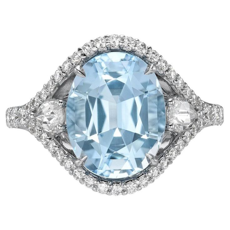 A Timeless Gift of Luxury: 4.26 Carat Aquamarine Oval Ring by Merkaba Jewelry Beverly Hills - Elevate your expression of love with this exceptional 4.26-carat Aquamarine oval ring, a stunning testament to luxury and sophistication. Crafted in radiant 18K white gold, this exquisite piece is enhanced by 0.30 carats of Rose Cut pear-shaped diamonds and 0.61 carats of round brilliant diamonds, creating an irresistible combination of vintage allure and modern chic. Perfect for marking milestones or s Class Jewelry, Trillion Diamonds, Designers Jewelry Collection, Rose Gold Diamond Ring Engagement, Aquamarine Ring, Oval Ring, Rose Gold Engagement, Rare Gemstones, Aquamarine Rings