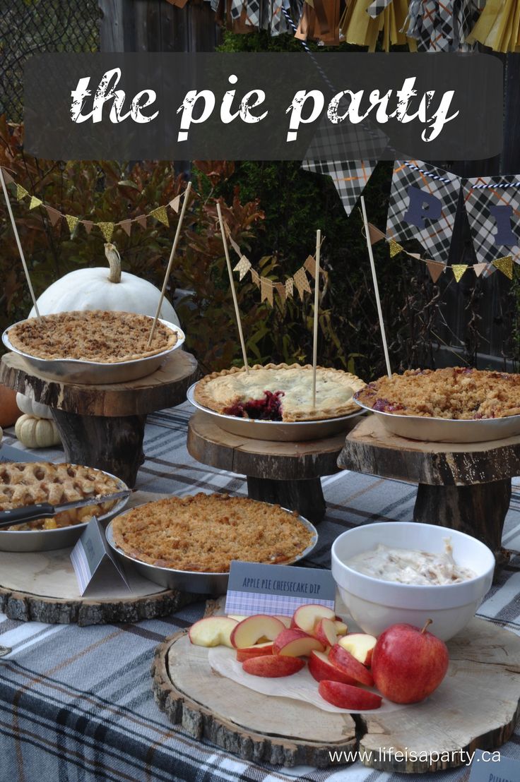 there are many pies on the table with apples and other desserts in bowls