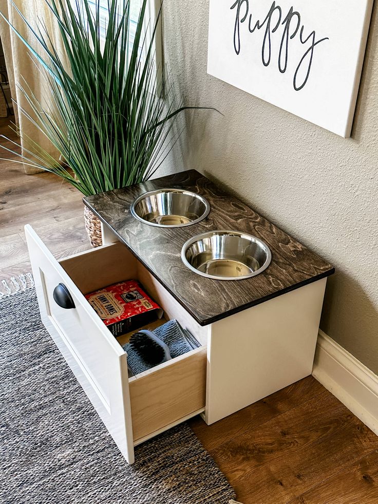 an elevated dog bowl with two bowls in it