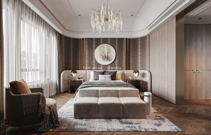 a bedroom with a large bed and chandelier hanging from the ceiling