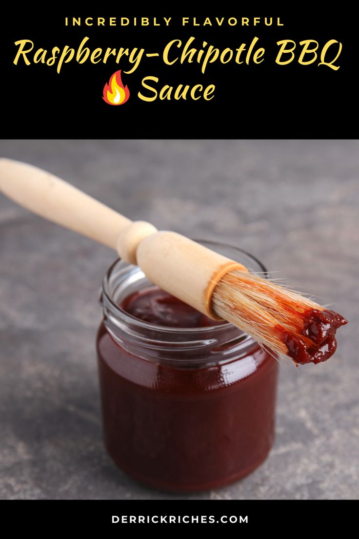 raspberry chipotie bbq sauce in a jar with a wooden spoon