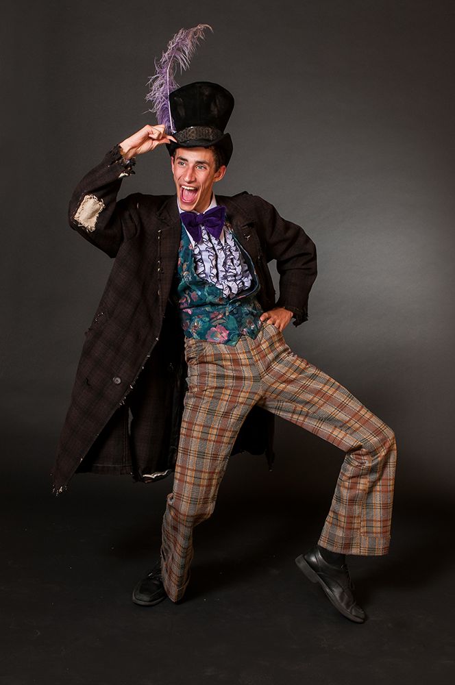 a man with a top hat and plaid pants