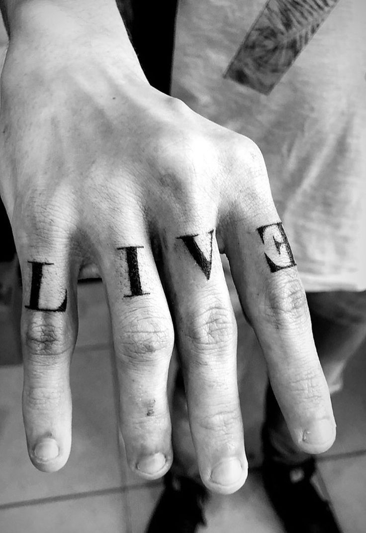 a person's hand with the word livve written on it and two fingers