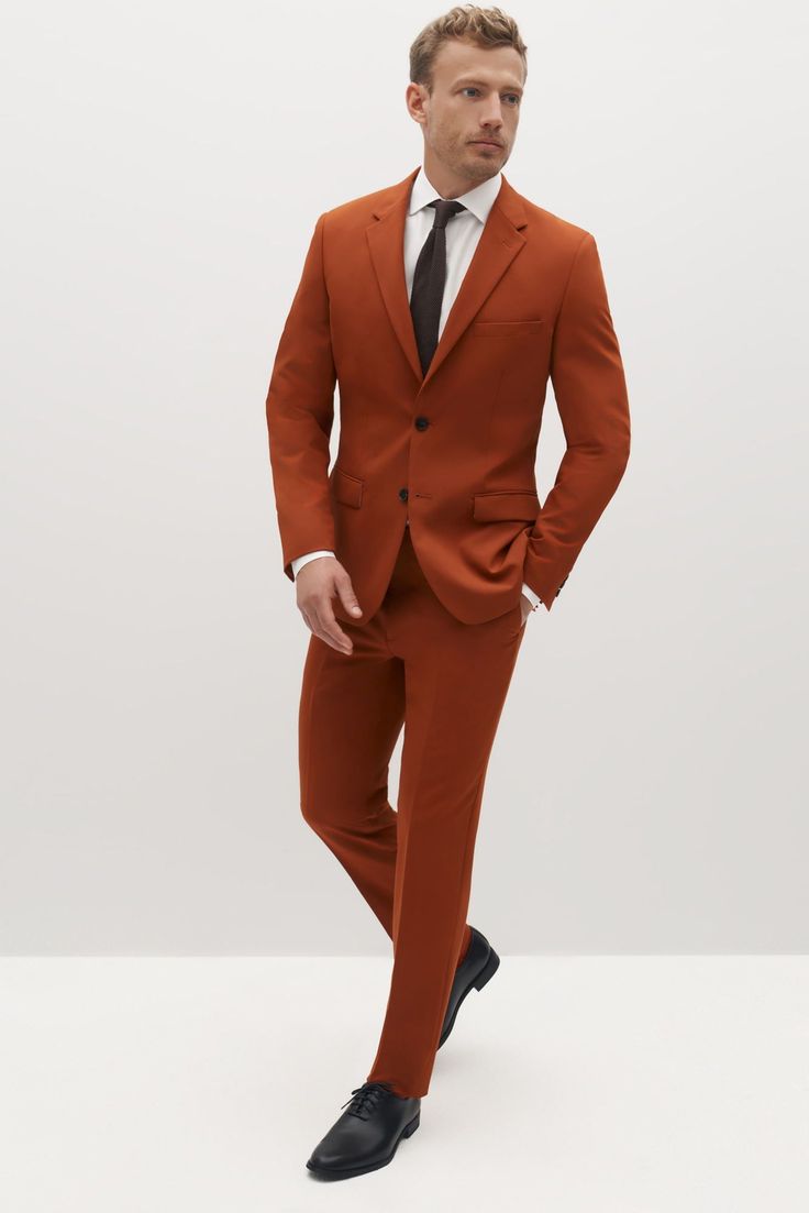 Suited for elegant statement-making and Street style alike, burnt orange is a bright way to liven up your look. Created in a rich, dark orange shade of terracotta, this men’s suit makes no compromises with style or personality and is perfect for any event. Burnt orange is crafted in our Eco Stretch fabric to give you flex where you want it and comfort where you need it. Formal Orange Outerwear With Notch Lapel, Tailored Suit For Groom In Fall, Formal Orange Notch Lapel Outerwear, Tailored Fall Suits For Groom, Tailored Fall Groom Suit, Classic Orange Blazer For Workwear, Orange Notch Lapel Blazer For Work, Classic Orange Blazer For Work, Fitted Orange Outerwear With Notch Lapel