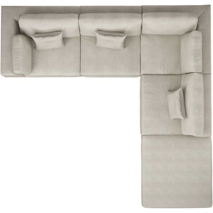 a couch that has pillows on it and is in the shape of a rectangle