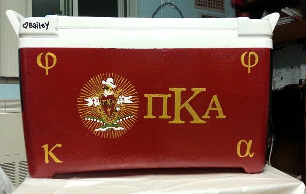 a red cooler with the letters ikea on it sitting on top of a table