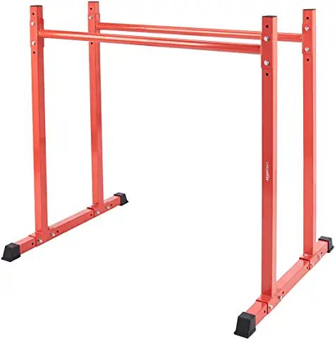 a pair of red metal racks with wheels on each side and one holding the bars