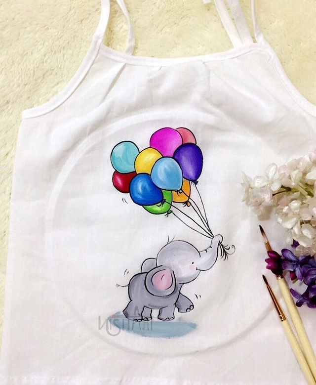 an elephant with balloons on it's back is next to some flowers and a paintbrush