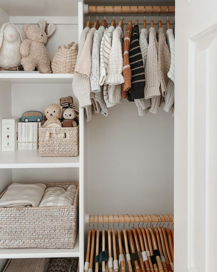 an organized closet with clothes, toys and other items in baskets on the shelfs