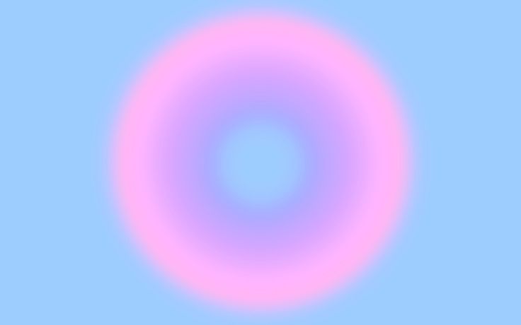 an image of a circular object in the sky with pink and blue hues on it