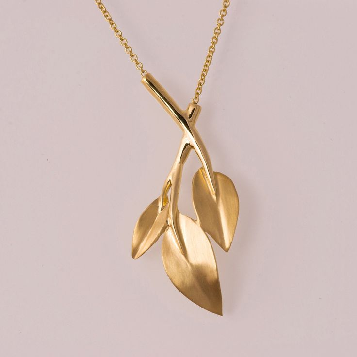 A handmade, solid 14k gold pendant in the shape of a vine with delicate leaves. Please choose the chain length at the menu, the price that appears is the total price for the pedant and chain. ----------------------DIMENSIONS---------------------- This beautiful, delicate pendant is about 42mm long and 19mm wide. -----------------------CUSTOM ENGRAVING---------------------- Custom engraving is available for most of our designs for 5$ per letter, we use laser equipment for high quality results. It Formal Yellow Gold Leaf Jewelry, Formal Yellow Gold Leaf-shaped Jewelry, Yellow Gold Leaf-shaped Formal Jewelry, Art Nouveau 14k Yellow Gold Necklace, Art Nouveau 14k Gold Pendant Necklace, 14k Gold Art Nouveau Pendant Necklace, Elegant Vine-shaped Jewelry For Gifts, Elegant Hand Forged Yellow Gold Necklace, Elegant Hand Forged Yellow Gold Necklaces