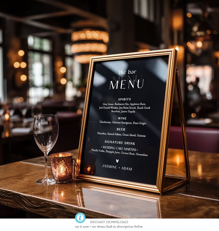 a menu sitting on top of a wooden table next to a wine glass and candle