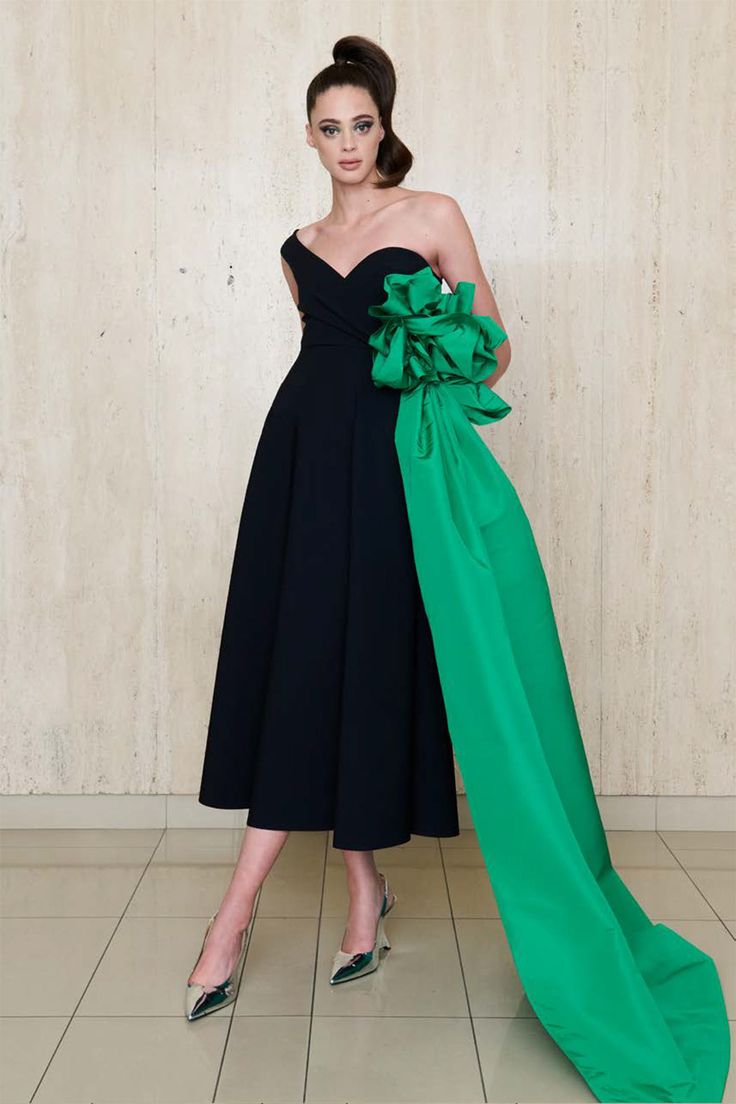 This elegant A-line gown features an asymmetrical neckline that gracefully drapes across the shoulders, paired with a dramatic flourish that adds a bold statement to the overall design. Perfect for making a striking impression at formal events, this dress combines classic lines with an unexpected, artistic twist. Please note that our Veeta is in the full length version. True to size 68% polyamide | 32% elastane body Made in Toronto | Fabric milled in Italy Dry Clean *Note that Special Order piec Greta Constantine, Green Side, Asymmetrical Neckline, A Line Gown, Women Dresses, Bosnia And Herzegovina, Black Tie, Trinidad And Tobago, Evening Wear