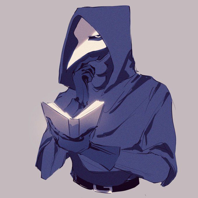 a man in a hoodie reading a book