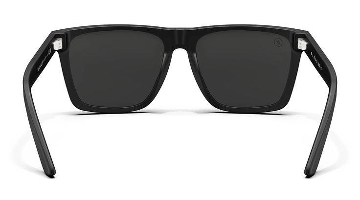 Black polarized sunglasses are a quintessential style staple. 'Blackjacket' takes the look and elevates it with a gloss-finish and molded metal inlays for durability and premium feel. The smoke lenses continue the all-black-everything mantra for a design that plays perfect with literally any fit. Do yourself a solid and mash that "Add to Cart" button! // Details: Gender Unisex Frame Gloss Black Lens Color Polarized Smoke UV Rating 100% UV Protection Fit / Size Medium - Large Vibe Lifestyle In th Black Sunglasses With Mirrored Lenses For Outdoor, Black Mirrored Sunglasses For Outdoor, Trendy Black Sports Sunglasses, Functional Black Shield Sunglasses With Tinted Lenses, Black Sunglasses With Gradient Lenses For Outdoor, Functional Polarized Sunglasses For Streetwear, Sleek Black Wayfarer Sunglasses, Functional Black Tinted Shield Sunglasses, Classic Black Aviator Sunglasses With Mirrored Lenses