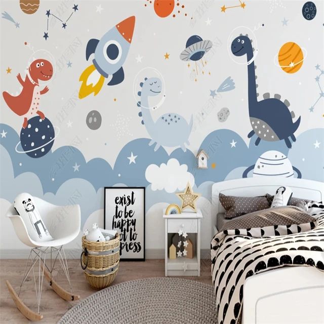 a child's bedroom decorated with space themed wallpaper