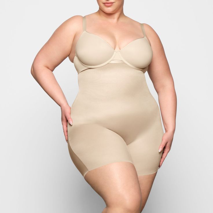 A signature SKIMS silhouette, now in light compression shapewear that targets the tummy and core. This everyday staple has adjustable straps, double-layered fabric on the bra, and a brief back for medium coverage. In between sizes? Size up for ideal fit. Second-skin Shapewear With Built-in Bra And Full Coverage, Full Coverage Second-skin Shapewear With Built-in Bra, Compressive Beige Shapewear With Built-in Bra, Solid Full Coverage Bra Friendly Bodysuit, Beige Full Coverage Shapewear With Medium Bust Support, Full Coverage Shapewear With Adjustable Straps, Adjustable Straps Full Coverage Shapewear, Beige Full Coverage Bodysuit With Built-in Bra, Compressive Bra-friendly Shapewear