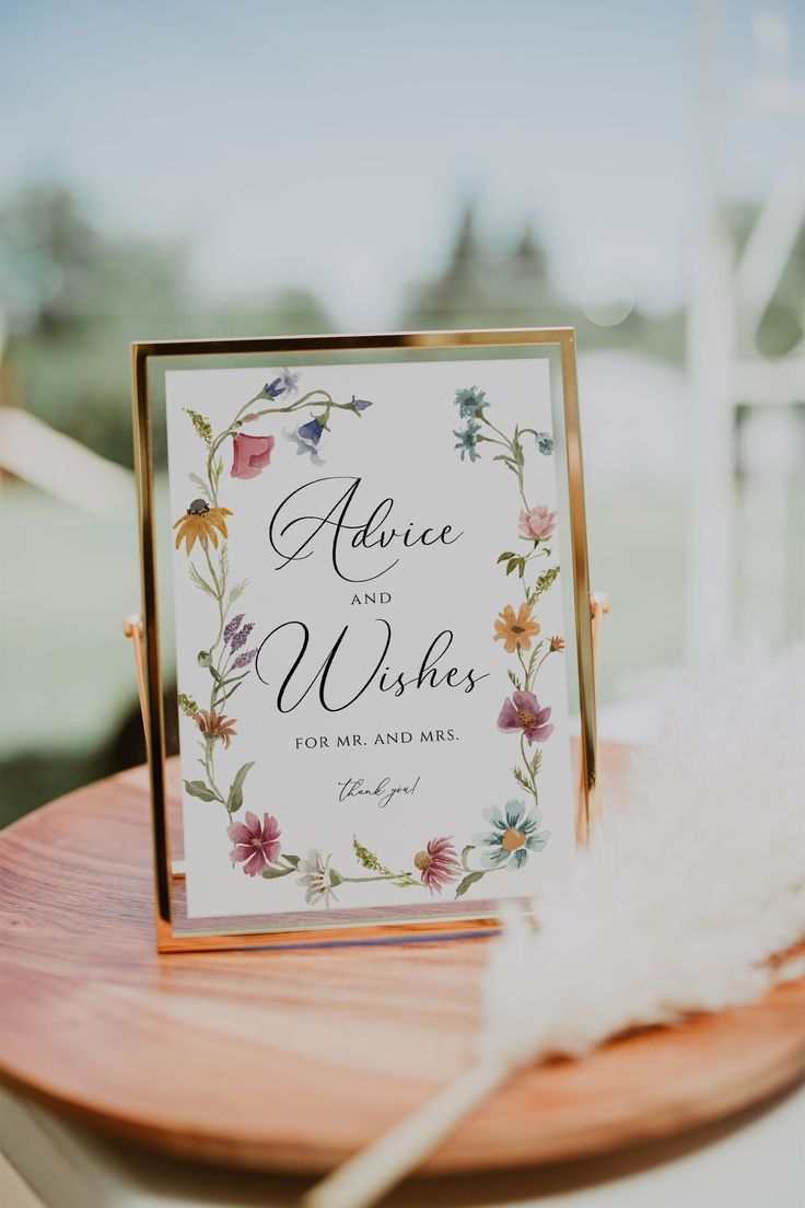 a sign that says advice and wishes on it sitting on top of a wooden table