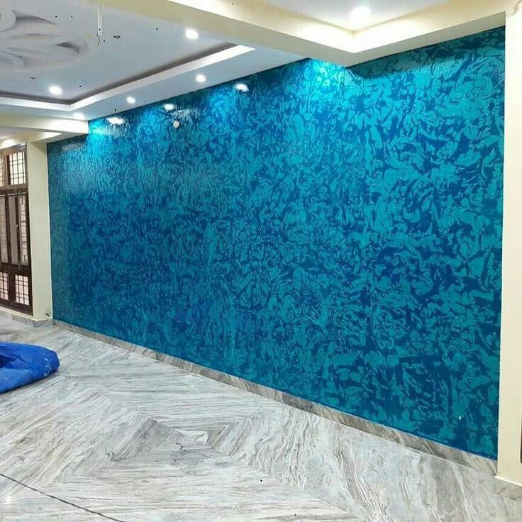 an empty room with blue and white walls