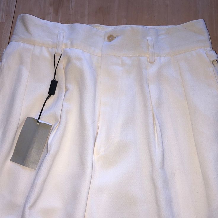 Classic Georgio Armani Trousers 35” Unfinished Length 9.5” Bottom Leg Measurement Loops For A Belt On The Waistband And Side Hip Buckled For Decoration Made In Italy High Waisted With Side Pockets 1 Outside Back Pocket One Of The Belt Loops (As Shown) Has Dark Mark On It White Straight Dress Pants With Belt Loops, Formal White Bottoms With Belt Loops, Tailored White Trousers, White Pants With Welt Pockets For Summer, White Tapered Leg Dress Pants For Summer, Tapered Summer Bottoms With Belt Loops, Formal White Bottoms With Pockets, White Relaxed Fit Formal Bottoms, Tailored White Pants For Summer