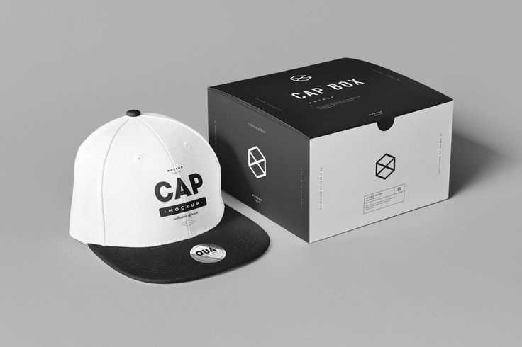 the cap box is next to it's packaging on a gray background with a black and white hat